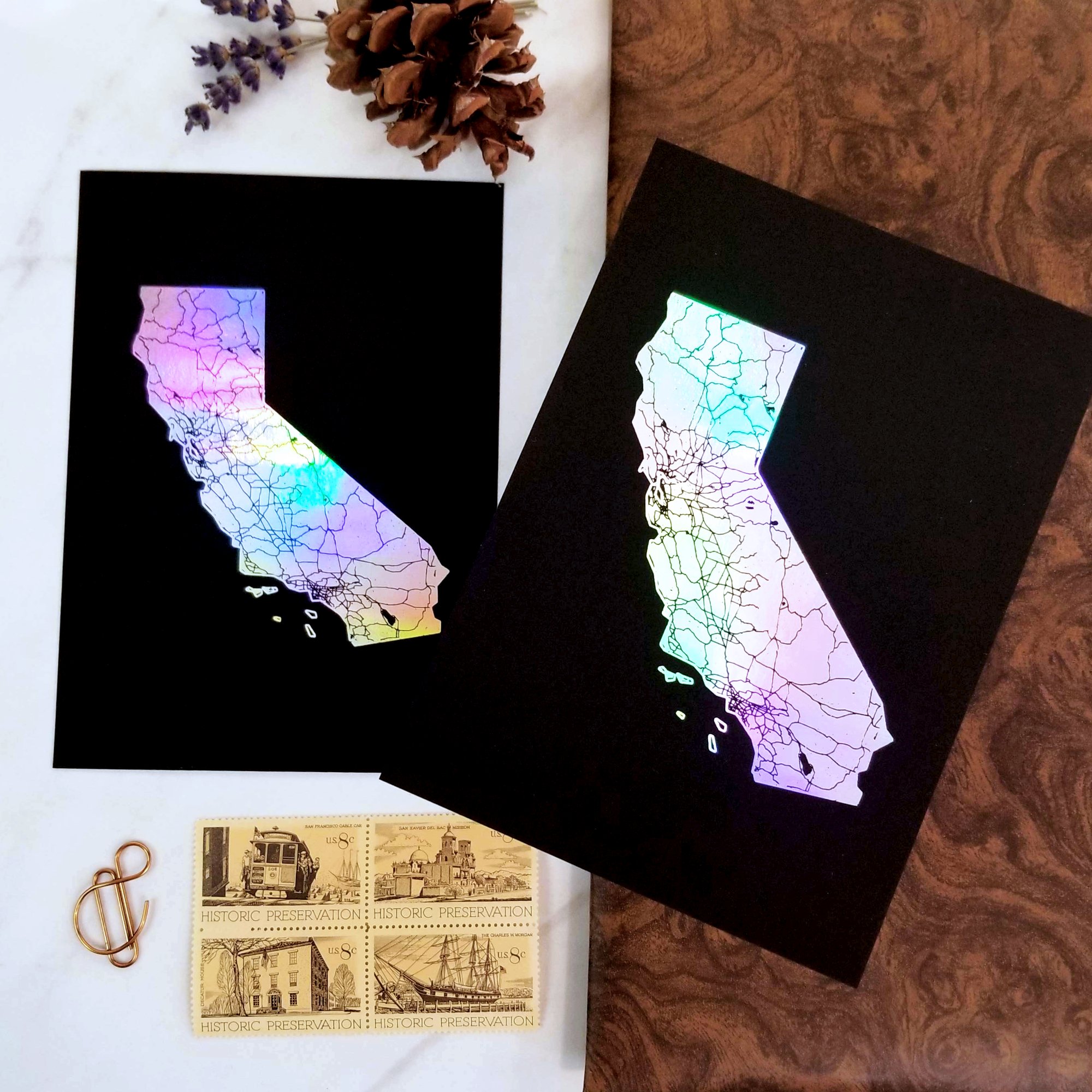 Holographic foil California state map prints on black paper
