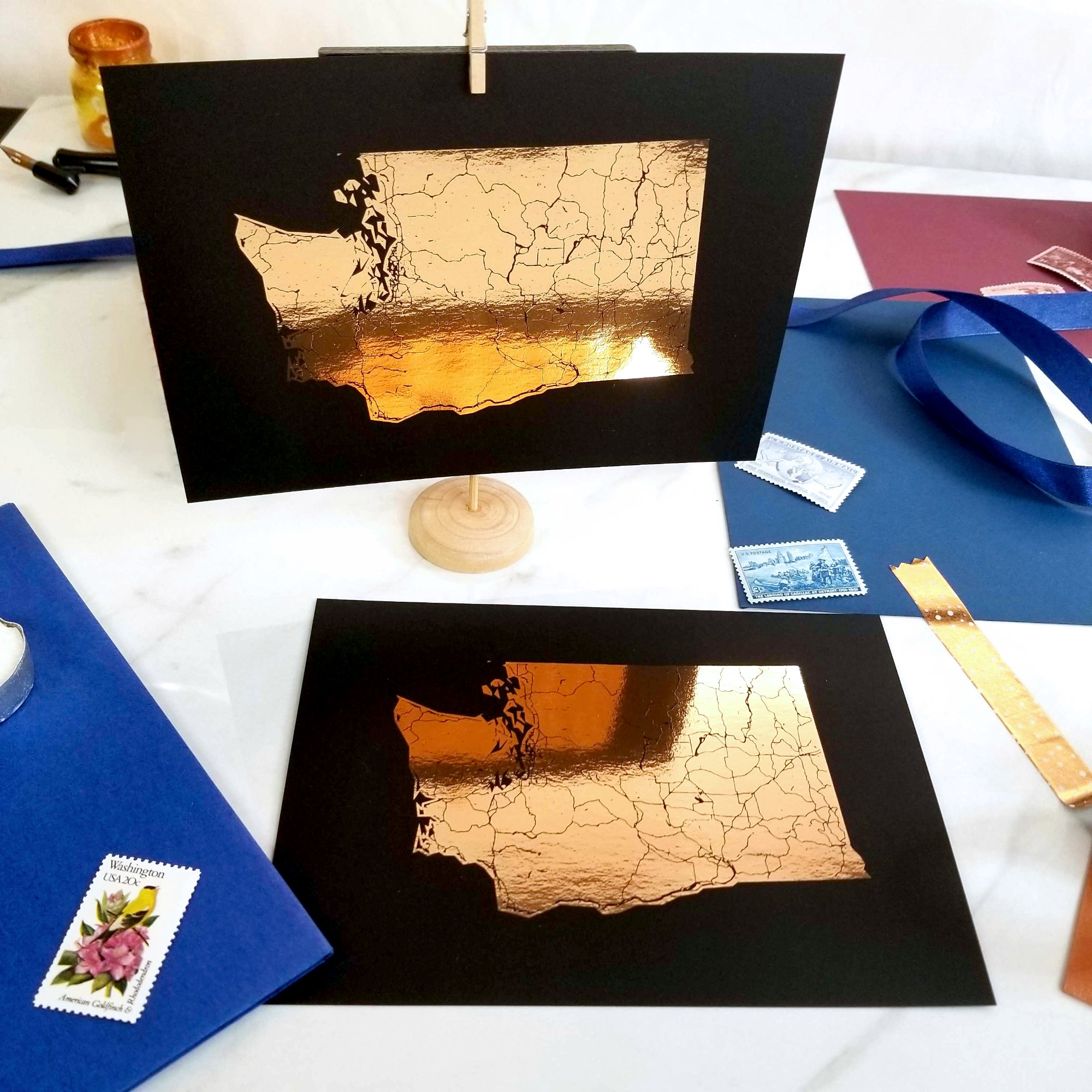 Copper foil Washington state map prints on black paper